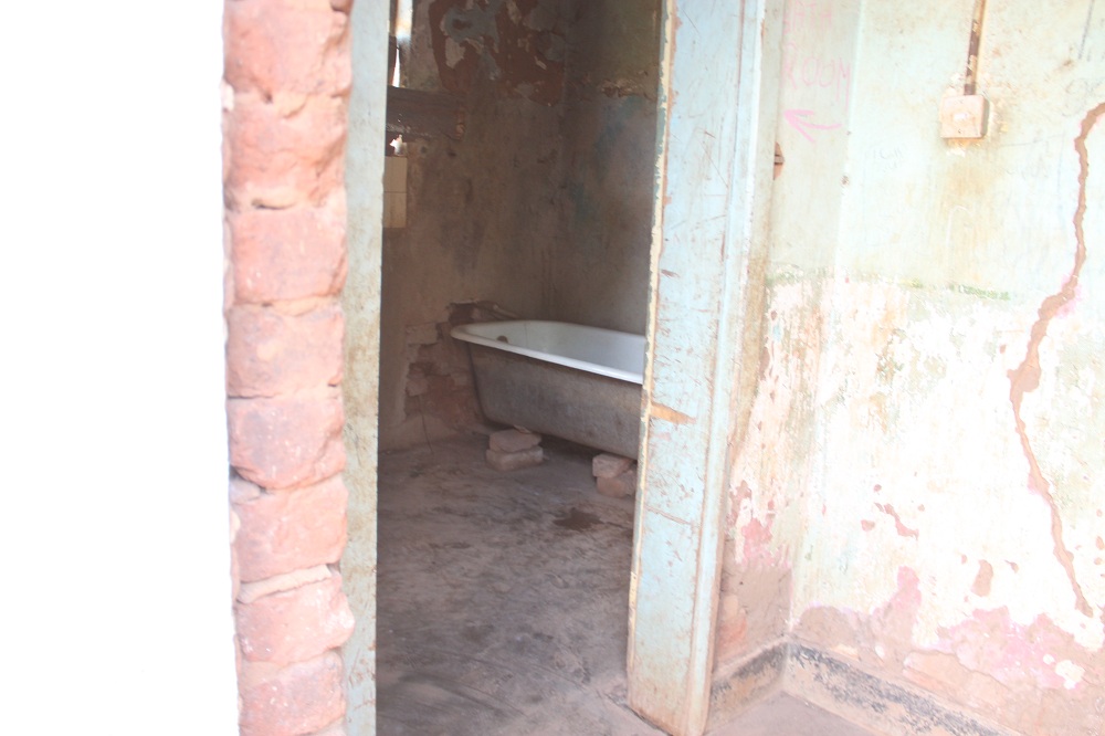 15 families are allegedly sharing this bathroom.