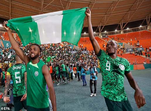 BATTLE ROYALE . . . Nigerian striker Emmanuel Emenike (left) battles for possession with Iran's Amirhoseein Sadeghi during their World Cup opening game at the Arena Baixada in Brazil last night. — Fifa.com