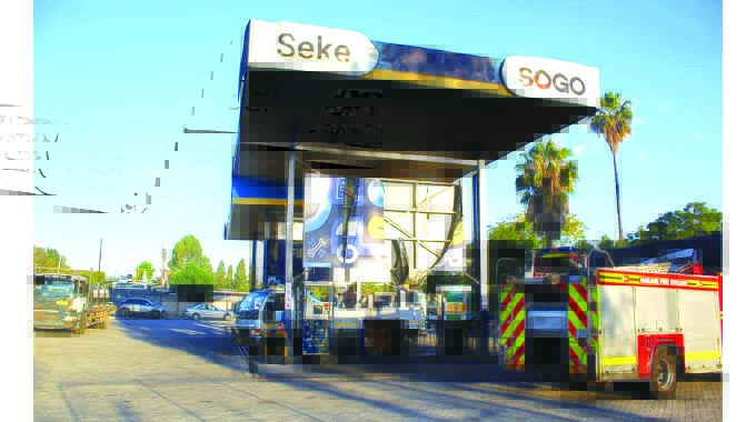 QUICK RESPONSE AVERTS . . . inferno at service station destroys tanker, two cars