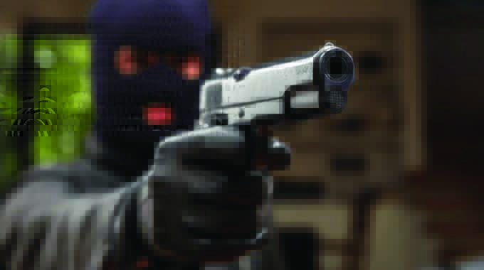 Armed robbers raid garage, shoot guard for US$670