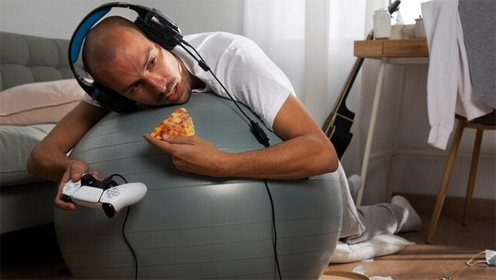 A sedentary lifestyle is characterised by prolonged periods of inactivity, such as sitting at a desk, watching television, or using mobile devices for extended hours