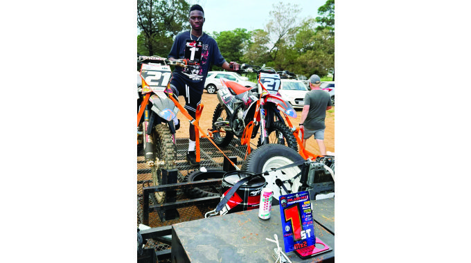 ON TOP OF THE TREE . . . One of Zimbabwe’s top motocross riders Emmanuel Bako proudly displays his trophy after sweeping to victory in the MX1 Class during the opening round of the 2025 Mayfair Gearbox Inland Championship at Erora in South Africa on Saturday