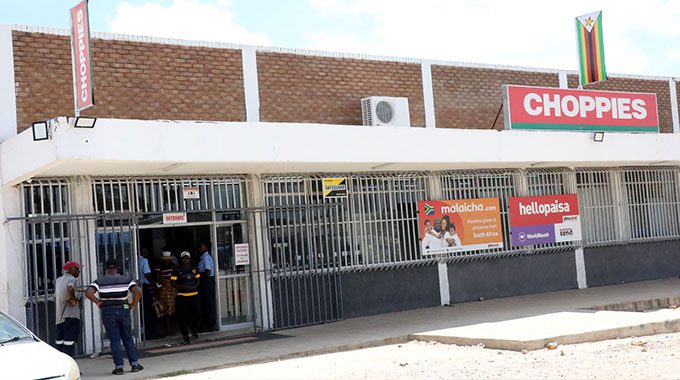 Residents stone armed robbers. . .Shop manager shot, mob steps in to help