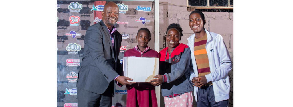 Westside Cricket Club Player of the Year – Under 13 Girls Rural Cricketer Delight Pasimupindu receives a hamper from Zimbabwe Cricket managing director Gift Makoni