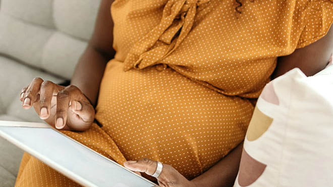 The pregnant woman feels that her husband does not seem interested in her anymore