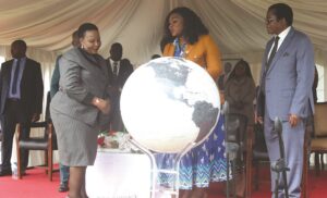 First Lady Dr Auxillia Mnangagwa receives a globe gift from ICT, Postal and Courier Services Minister Tatenda Mavetera (centre) and POTRAZ director-general Dr Gift Machengete during the 2025 national World Telecommunication and Information Society Day commemoration at Rudhaka Stadium