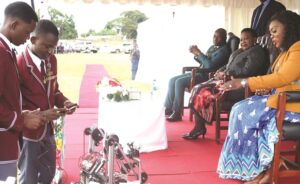 First Lady Dr Auxillia Mnangagwa looks on as Tynwald High School learners exhibit their robot during the 2025 national World Telecommunication and Information Society Day commemoration at Rudhaka Stadium