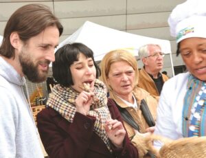 European delegates taste chicken feet, which form part of Zimbabwean traditional dishes, during the 1st edition of the Paris 17th International Gastronomy Festival on the sidelines of UNESCO Africa Week celebrations in Paris yesterday