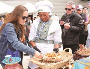 Delegates scramble to taste kapenta, which form part of the Zimbabwean traditional dishes, during the 1st edition of the Paris 17th International Gastronomy Festival on the sidelines of UNESCO Africa Week celebrations in Paris yesterday