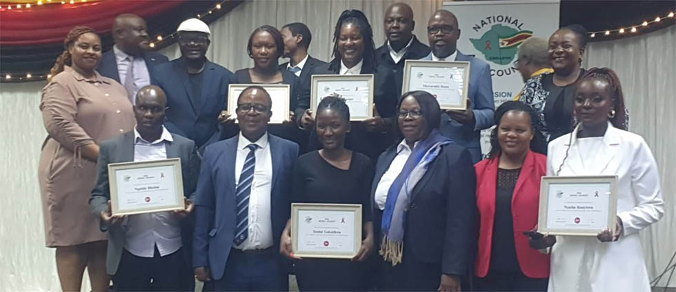 Tendai Gukutikwa (third from left, front row) poses for a photo with the other award winners