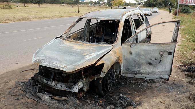 GAS BOMB TERROR: Car reduced to scrap in fiery blast!