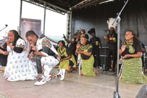 Diana Samkange and Andy Muridzo lead the Zimbabwean cultural group comprising local artistes, men and women from the Zimbabwe Republic Police, Air Force of Zimbabwe and Zimbabwe Prisons and Correctional Service in singing traditional songs during the 1st edition of the Paris 17th International Gastronomy Festival in Paris, France, yesterday. — Pictures: John Manzongo