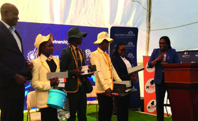 Chief Commercial Officer for Dandemutande, Lorraine Nyahwa commends students from Rimbi Secondary who presented a mind-blowing innovation at the AI and Machine Learning Conference