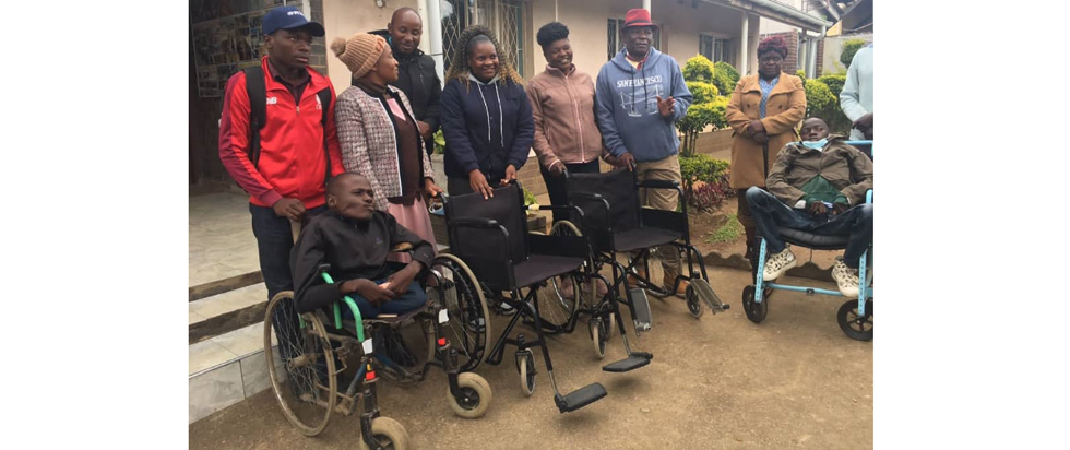 Mr Tendai Mazuru (left) donates three wheelchairs to people with disabilities