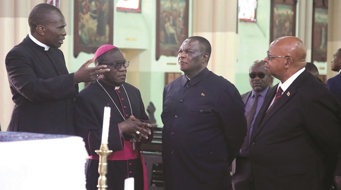 Vice President Constantino Chiwenga (second from right), Speaker of the National Assembly Advocate Jacob Mudenda (right) and Roman Catholic Archbishop of Harare Robert Christopher Ndlovu listen to Vicar-General Kennedy Muguti at the Cathedral of the Sacred Heart of Jesus in Harare yesterday