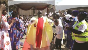 Father Fidelis Mukonori joins congregants on the dance floor during the centenary celebrations for the Cathedral of the Sacred Heart of Jesus yesterday. — Pictures: Joseph Manditswara