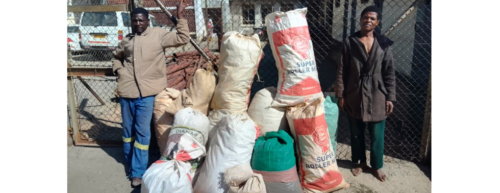 END OF THE ROAD . . . James Bvekerwa (left) and Collin Manyara flanking the sacks they had stashed with processed dagga destined for an unknown destination at Rusape Rural Police Station