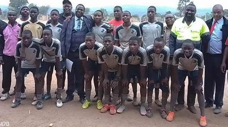 Victorious St Mathias Tsonzo High School Under 17 team that will represent Manicaland province in the national finals next week poses for a picture with officials including Manicaland provincial director Richard Gabaza (in purple suit) at last week's provincial finals held at Chibuwe High School in Chipinge