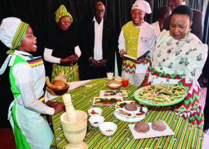 Culture and Heritage Ambassador First Lady Dr Auxillia Mnangagwa and other delegates look at Matabeleland South traditional dishes prepared by schoolchildren during a gastronomy competition running concurrently with the zviperengo cultural quiz in Matabeleland South yesterday