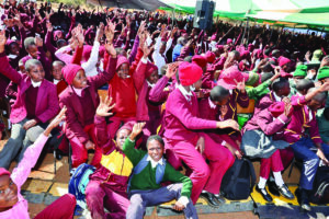 Schoolchildren raise hands during their interaction with First Lady Dr Auxillia Mnangagwa at the cultural quiz programme in Matabeleland South yesterday