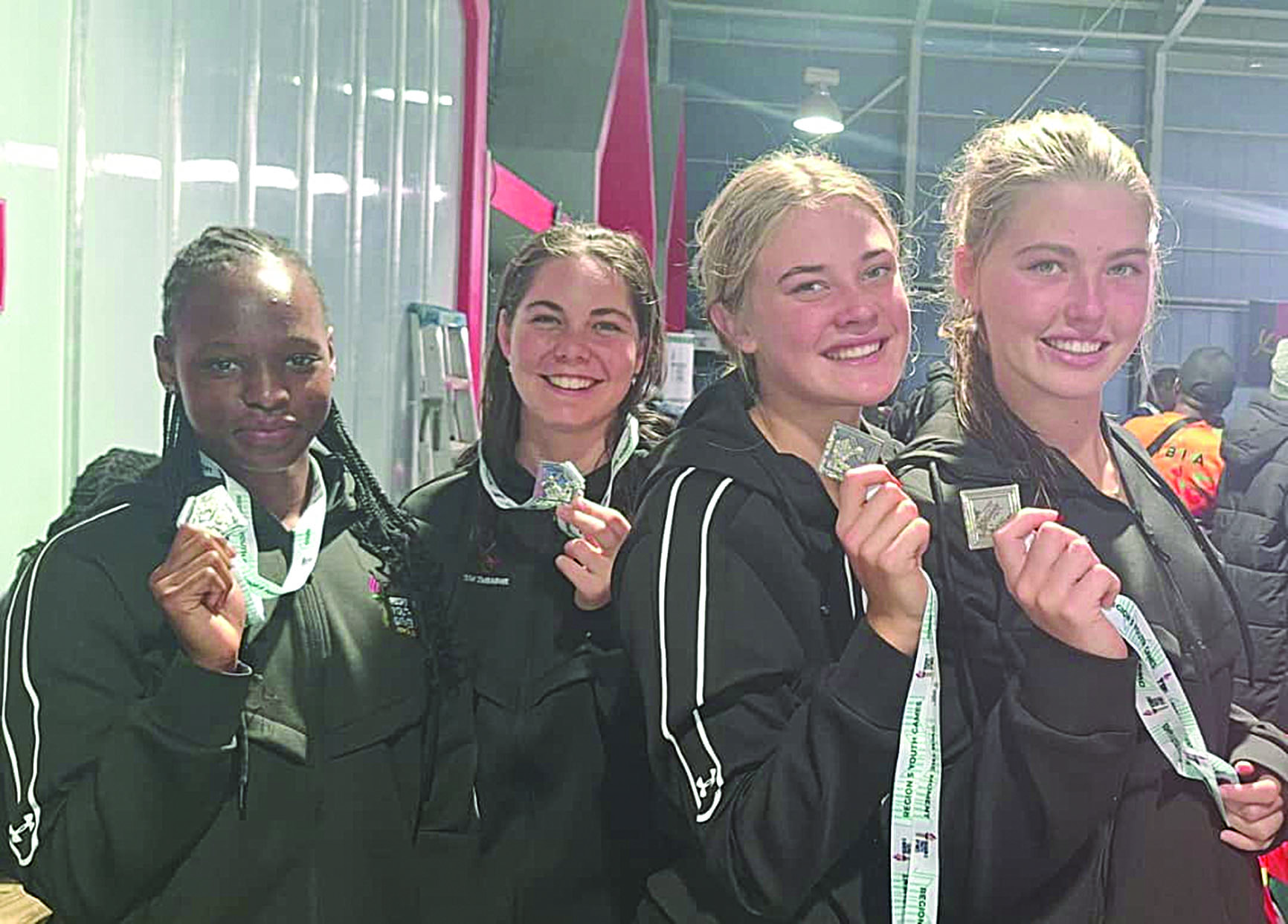 GIRL POWER . . . Zimbabwe’s relay team (from left) Mikayla Makwabarara, Anje Van As, Alexis Johnsen and Tori Dawe display the silver medals they won at the Region 5 Games in Namibia