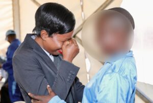 A woman sheds tears of joy as she hugs her younger sister, a survivor of drugs and substance abuse, during a visit by relatives to see how patients are recovering at the Angel of Hope Drug Rehabilitation Centre on Friday