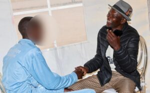 A father shares a lighter moment with his son, who is a patient at the Angel of Hope Drug Rehabilitation Centre during a visit on Friday