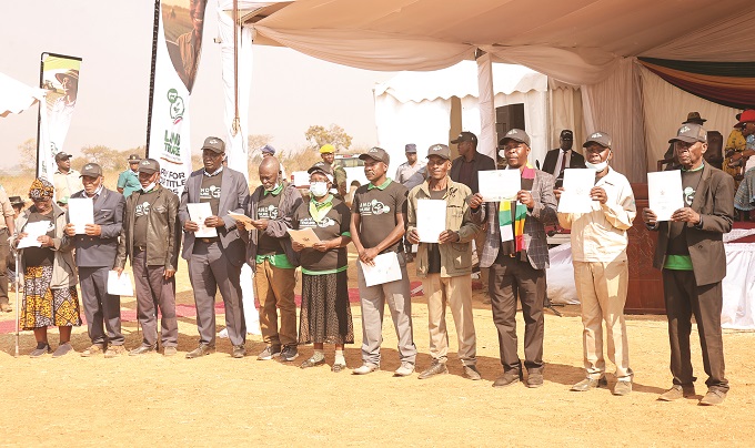 Empowered: Some of the 1 000 farmers who were given land title by President Mnangagwa in Mazowe on Monday