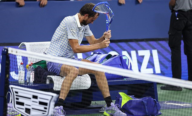 Russia’s Daniil Medvedev breaks his racket after losing his men’s singles match