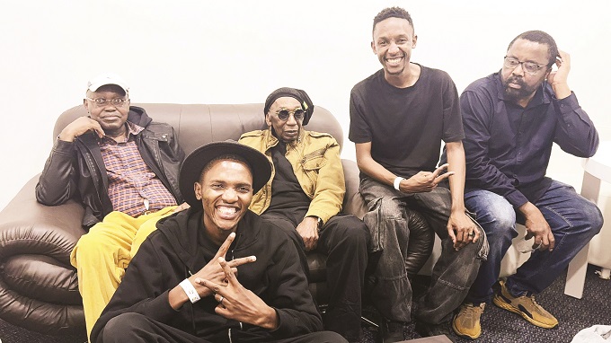 Some of the Intotal Band members pose for a photo with Thomas Mapfumo (centre)