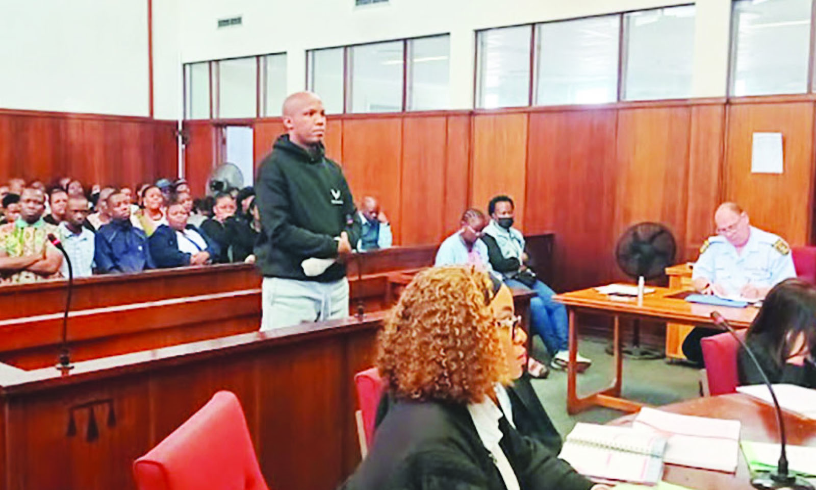 Smiling cop charged with wife’s murder angers victim’s daughter