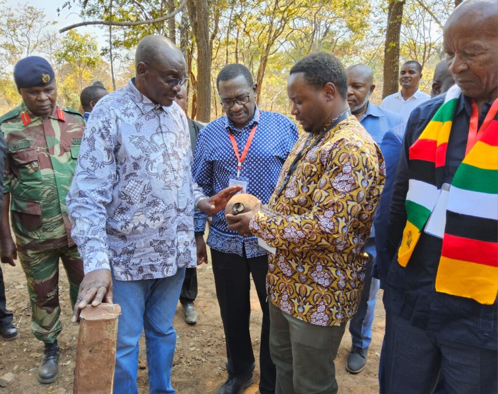 VP Mohadi directing INSTAK CEO to take an artifact to the Museum of African Liberation, being a remnant part of bombs dropped from the air by Rhodesian Army that massacred more than 400 freedom fighters in 1979 at ZIPRA Boma Camp, Moxico Province, Angola