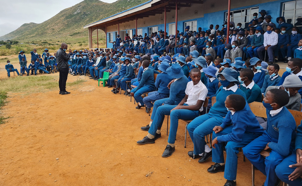 Windows of Hope Zimbabwe programmes manager, Mr Darlington Chikamhi addresses learners at Joshua Dhube Primary School in Dangamvura