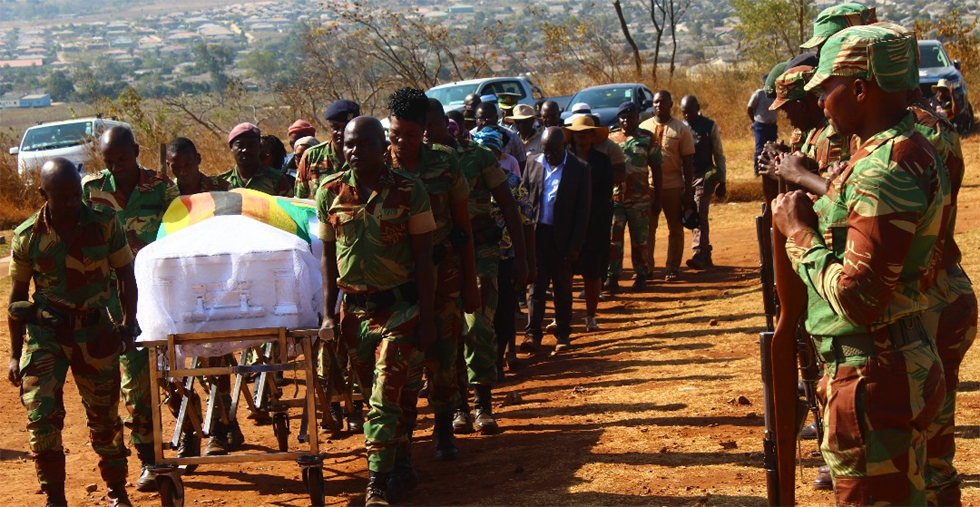 Pallbearers carry Cde Amos Chinyamutangira's body to its final resting place at Manicaland Provincial Heroes Acre this afternoon