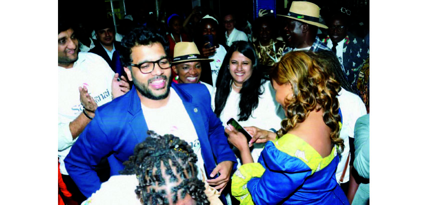 Minister Rwodzi (wearing straw hat) mingles with some of the buyers