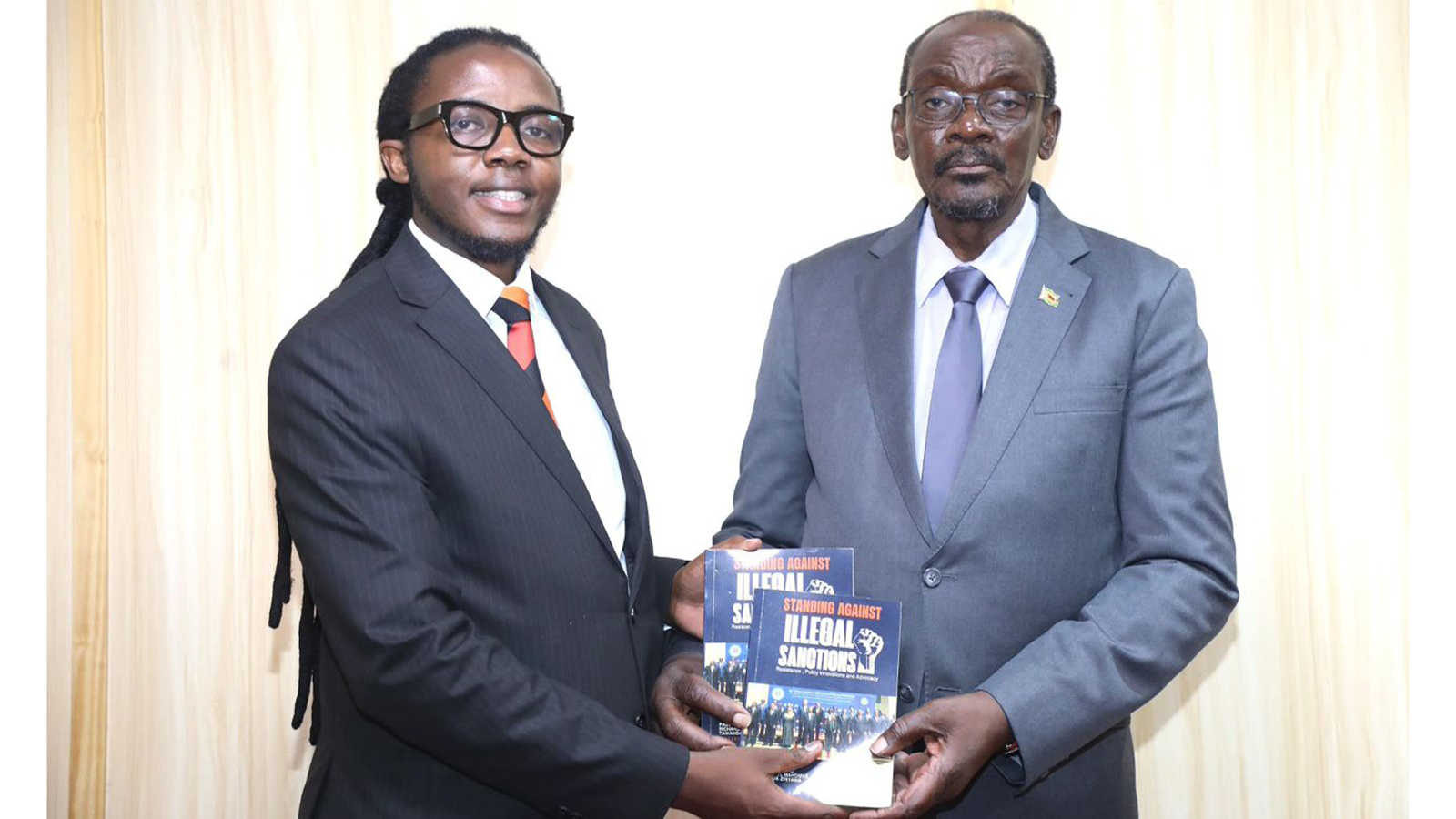 Mahomva presents latest book on sanctions to Vice President Mohadi