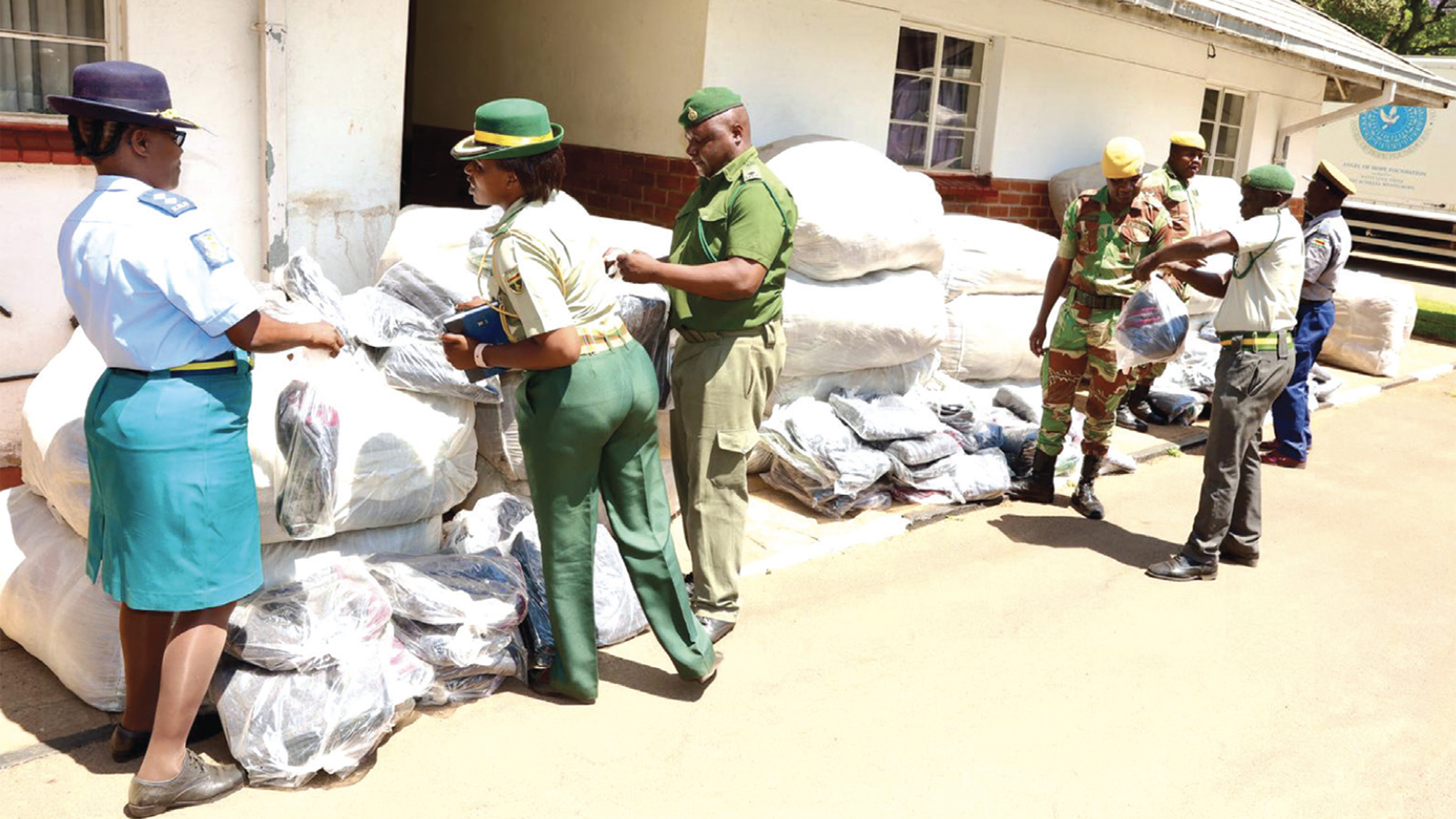 Medical personnel from the Zimbabwe Republic Police, Zimbabwe Prisons and Correctional Servicesand the Zimbabwe National Army sort the blankets they received from the patron of the Angel of Hope Foundation, First Lady Dr Auxillia Mnangagwa, at Zimbabwe House yesterday