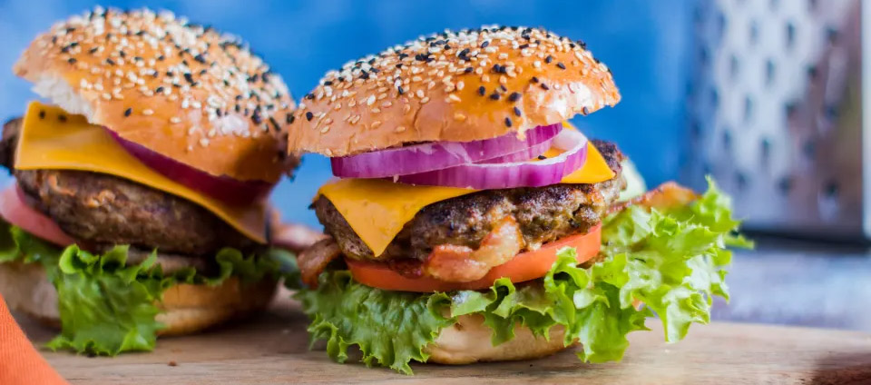 These wonderful cheese-stuffed burgers with bacon and caramelised onions are easy to adapt to suit different tastes