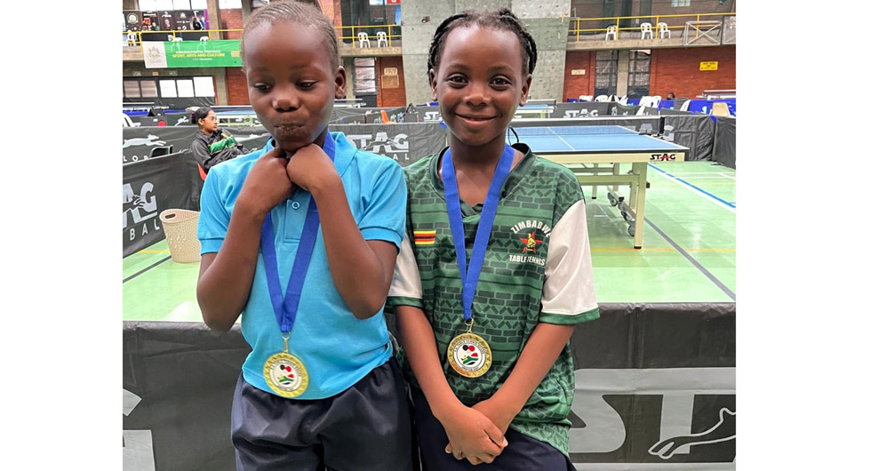 Gold medallists, Princess Tichiwangani and Prudence Pashi get a Kodak moment after the competition
