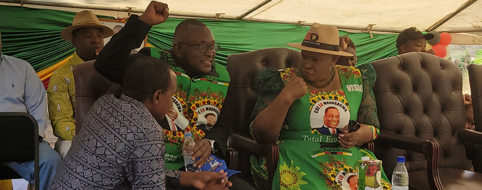 ZANU PF Secretary for Women’s Affairs, Cde Mabel Chinomona (right) chants a slogan together with Information Publicity and Broadcasting Services, Dr Jenfan Muswere (left) at a ZANU PF Women’s League meeting at Chiwetu Training Centre in Makoni West Constituency on Wednesday - Picture: Tinai Nyadzayo