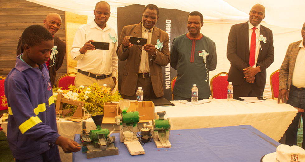 Tinashe Chizanga operates a grinding mill he designed