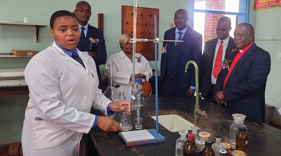 Upper Six Chemistry learner, Nicole Mutungwazi demonstrates an experiment to dignitaries last Friday