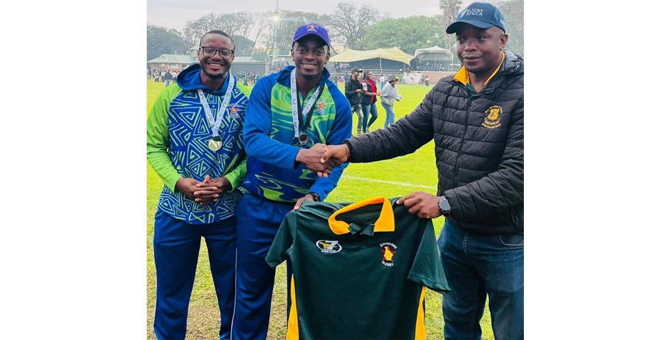 Gideon Myambo (centre) received a jersey as a symbol of appreciation for officiating in the recent Zambezi Cup