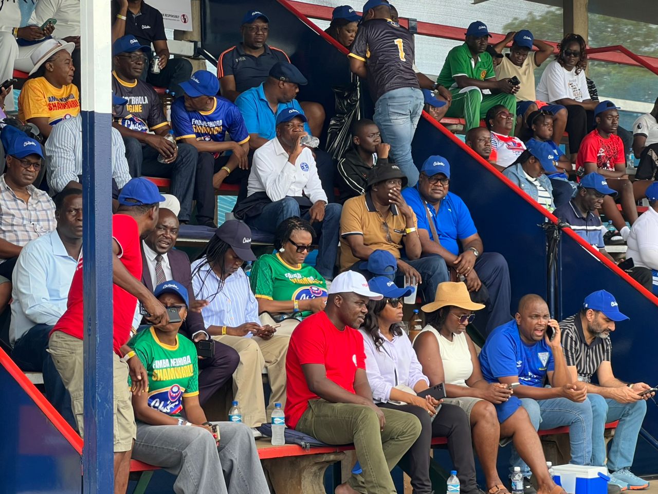Dynamos SG Webster Marechera (in white shirt and drinking water), is unconcerned with the drama unfolding before thousands of fans