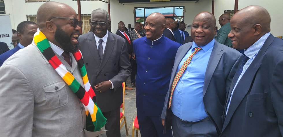 Minister of State for Manicaland Provincial Affairs and Devolution, Advocate Misheck Mugadza (left, shares a lighter moment with Defence Deputy Minister, Brigadier General (Rtd) Levy Mayihlome (second from left), Army Headquarters Chief of Staff, Major General Kasirai Tazira (in blue suit) and other Government officials during the official opening of the Ministry of Defence’s Strategic Planning Workshop in Mutare on Wednesday.- Picture: Tinai Nyadzayo