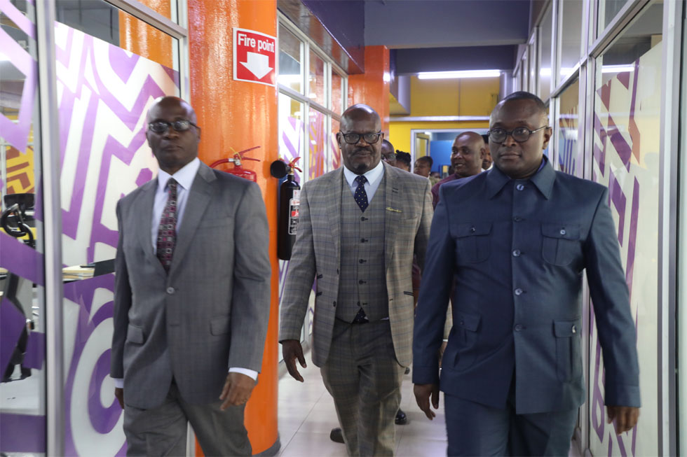 Minister Muswere and Premanant Secretary Mr Nick Mangwana being taken on tour of the Zimpapers integrated newsroom