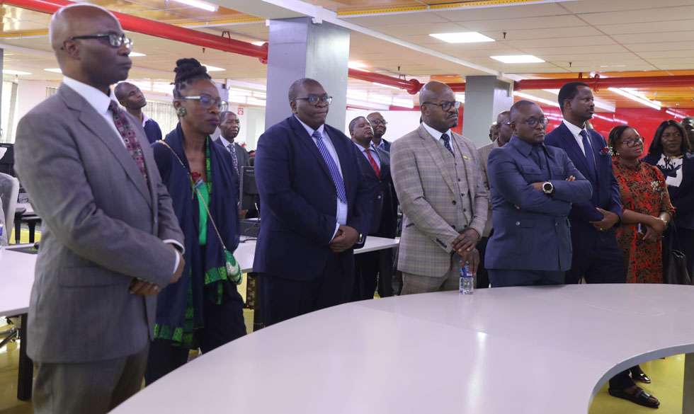 Minister Muswere and other delegates being shown some aspects of the Zimpapers integrated newsroom