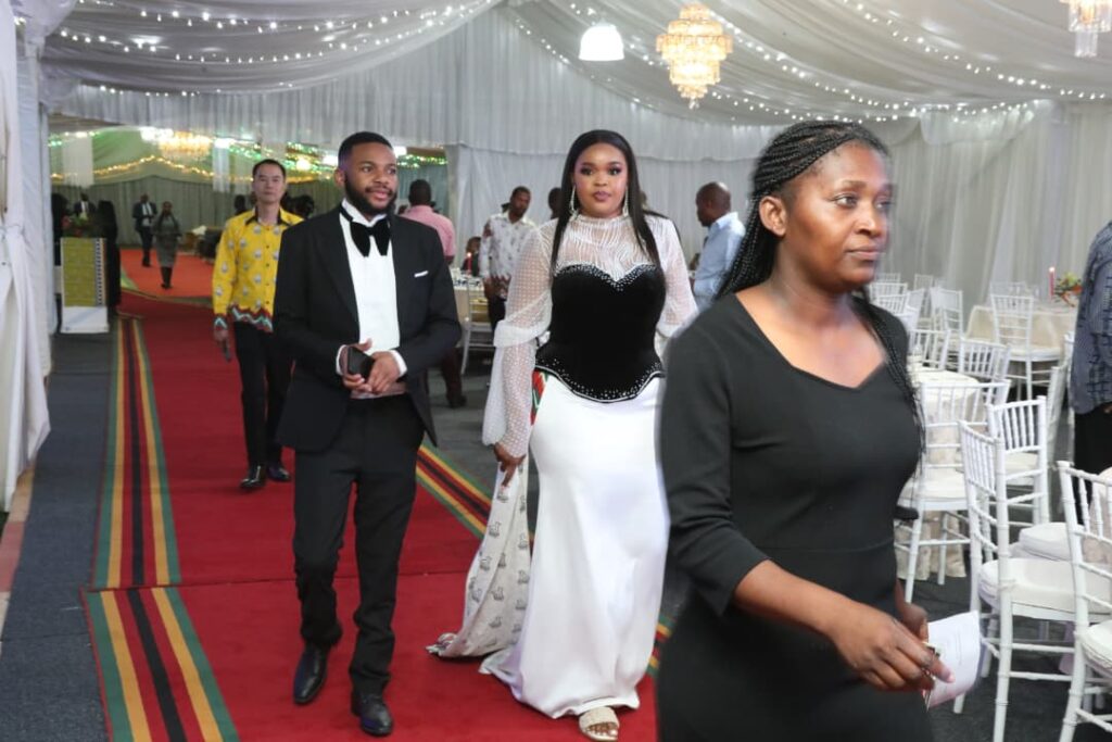 Fashion extravaganza... Some of the delegates showcase their national clothing during the Cultural Gastronomic Dinner at State House in Harare on Friday night