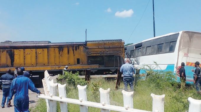 4 escape death as train, bus collide in Hwange