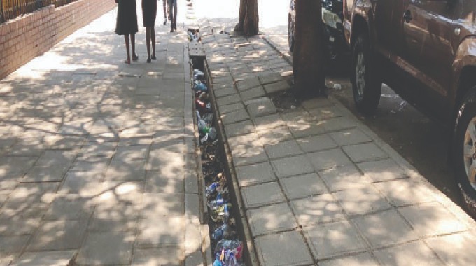 When the rains fall, Zimbabwe’s plastic crisis floats to the surface